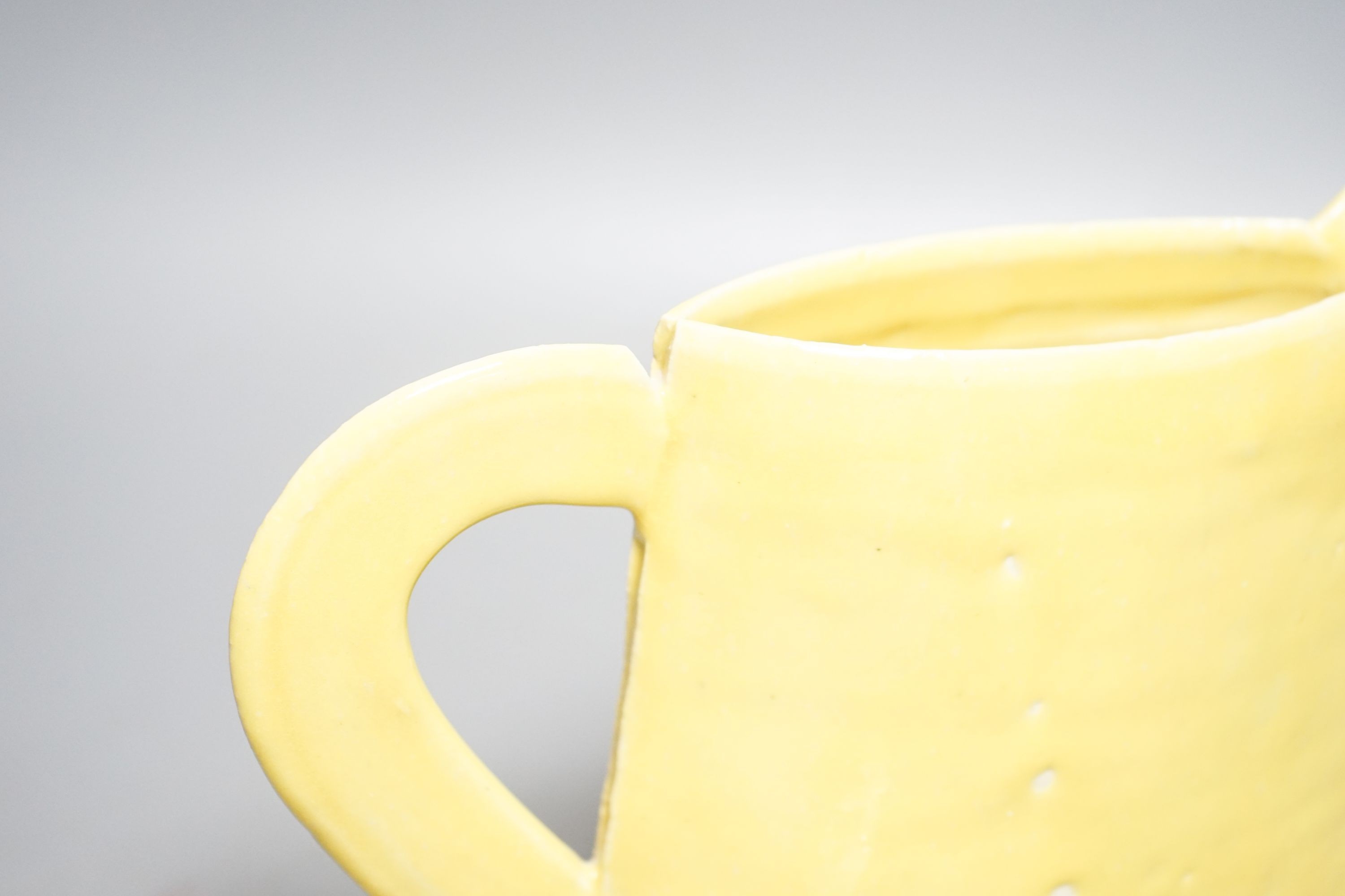 Emmanuel Cooper (1938-2012), a yellow glazed jug 20cm